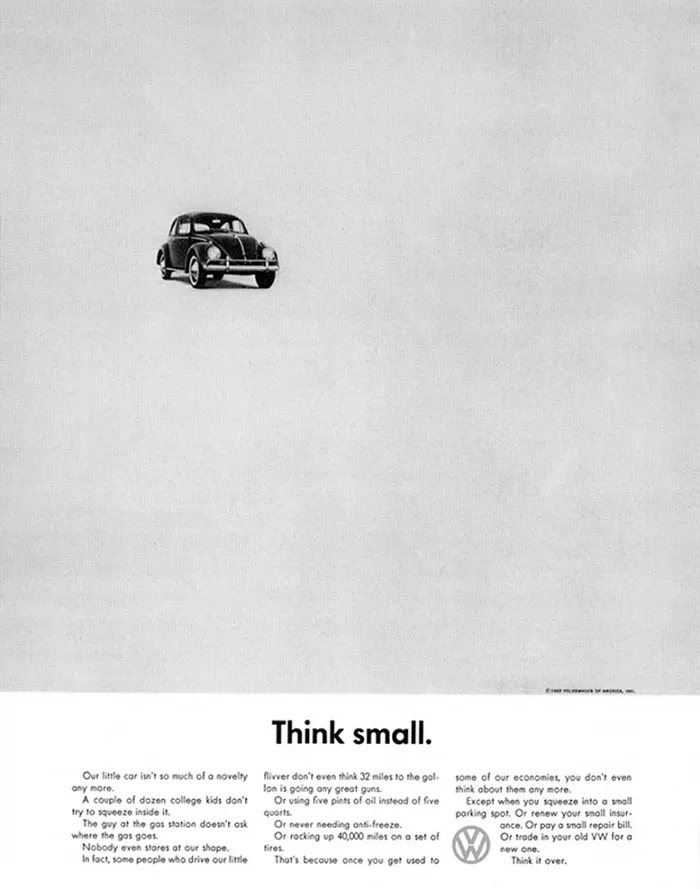 A small volkswagen car in the distance and the title at the bottom is Think Small.